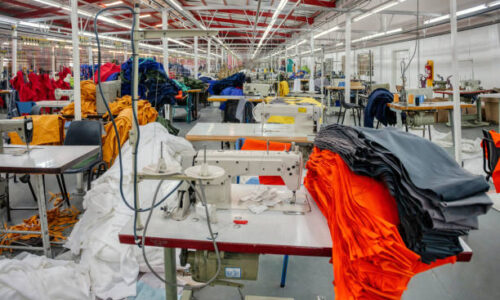 Small entrepreneur in Africa, Botswana, industrial textile factory manufacturing safety gear
